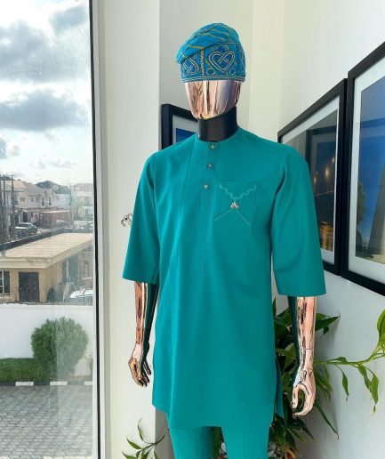 A Jade Green, front flap, valley perspective pocket design and Swarovski button details african traditional kaftan native.