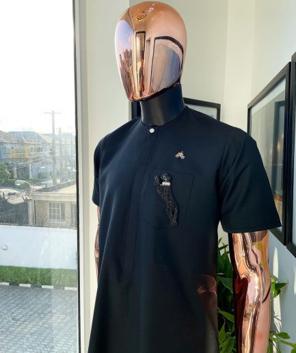 A Charcoal black, front flap, roaring tiger patch design and Swarovski button details african traditional senator kaftan native.