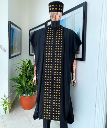 A Reloaded charcoal black, connected square embroidery design with matching gold and red Swarovski stone details agbada