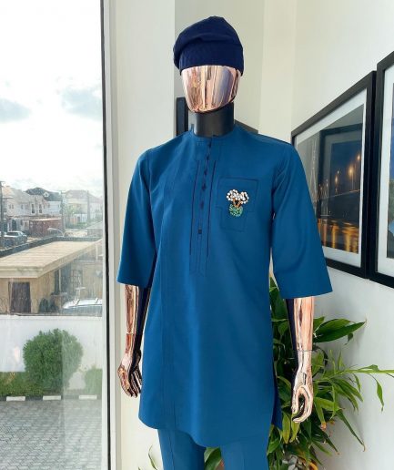 A sapphire blue, front flap, embroidery square rectangle flap and pocket design African traditional senator kaftan native.