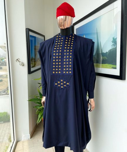 A reloaded midnight blue, connected square embroidery design with matching gold and red Swarovski stone details agbada