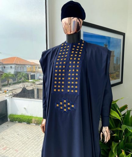 A reloaded midnight blue, connected square embroidery design with matching gold and red Swarovski stone details agbada