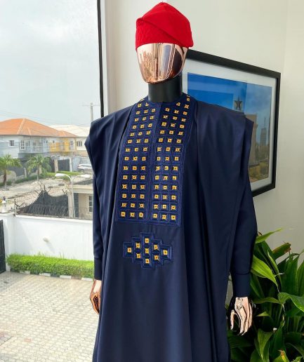 A reloaded midnight blue, connected square embroidery design with matching gold and red Swarovski stone details agbada
