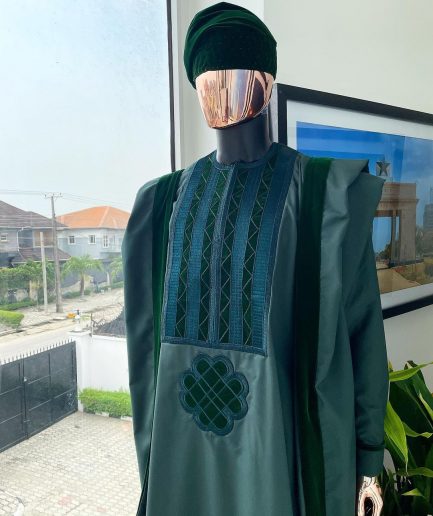 A reloaded British racing green Monochrome embroidery with soaked Italian velvet detailing agbada