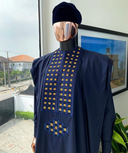 A reloaded midnight blue, connected square embroidery design with matching gold and red Swarovski stone details agbada