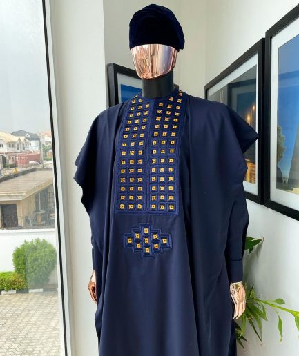 A reloaded midnight blue, connected square embroidery design with matching gold and red Swarovski stone details agbada
