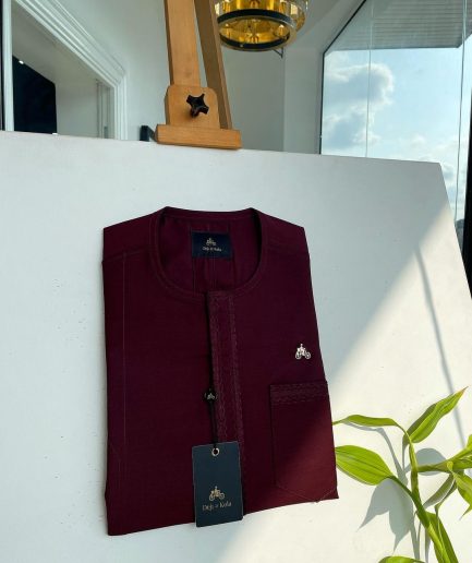A mahogamy red, spiral layered flap and pocket embroidery detailing african traditional senator kaftan native.