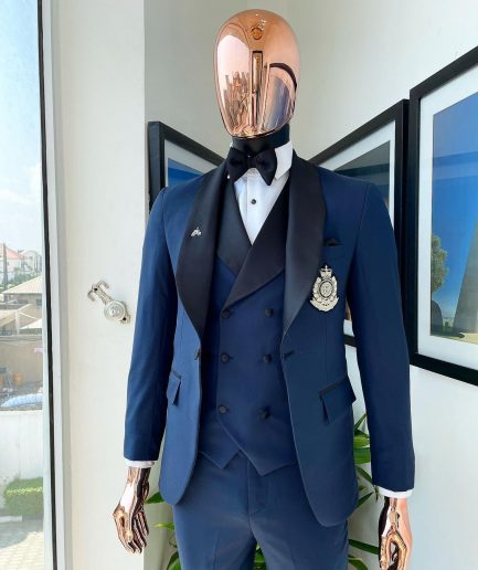 A Midnight Blue with black shawl lapel tuxedo suit