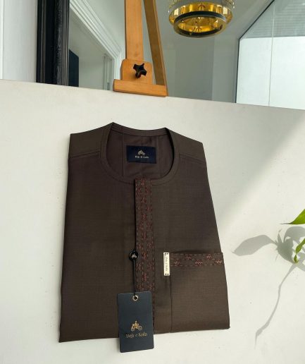A Umber brown, rectangle lanes and dotted front flap and pocket embroidery detailing African traditional senator kaftan native.