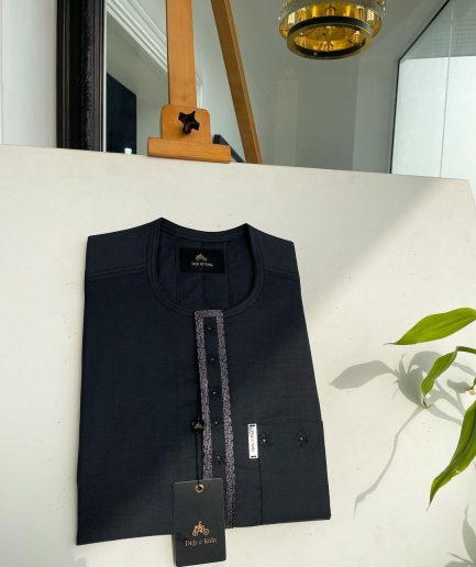 A Sacramento green, rectangle lanes and dotted front flap and pocket embroidery detailing african traditional senator kaftan native.
