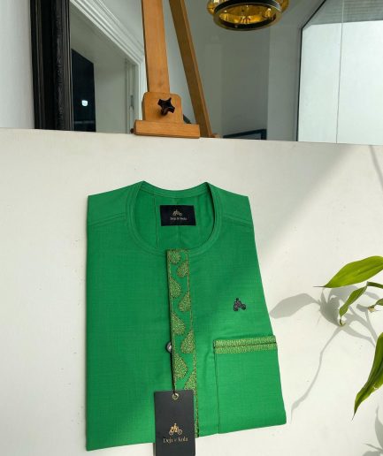 A Kelly green, wavy (plum) light front flap and pocket embroidery detailing African traditional senator kaftan native.