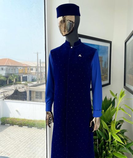 The “orunmila” navy blue Trench soaked Italian velvet traditional jacket with black Swarovski stones detailing, matching hat, cobalt blue Senator kaftan & pant trousers.
