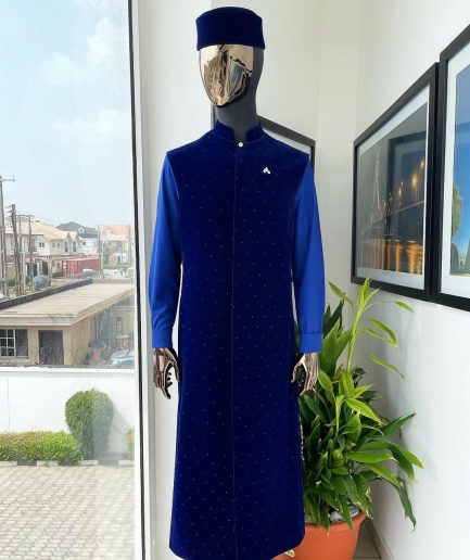 The “orunmila” navy blue Trench soaked Italian velvet traditional jacket with black Swarovski stones detailing, matching hat, cobalt blue Senator kaftan & pant trousers.
