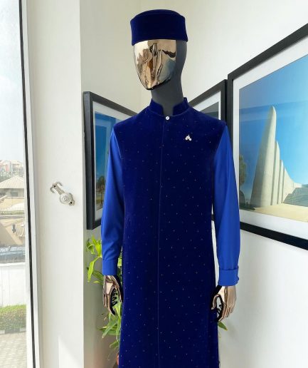 The “orunmila” navy blue Trench soaked Italian velvet traditional jacket with black Swarovski stones detailing, matching hat, cobalt blue Senator kaftan & pant trousers.