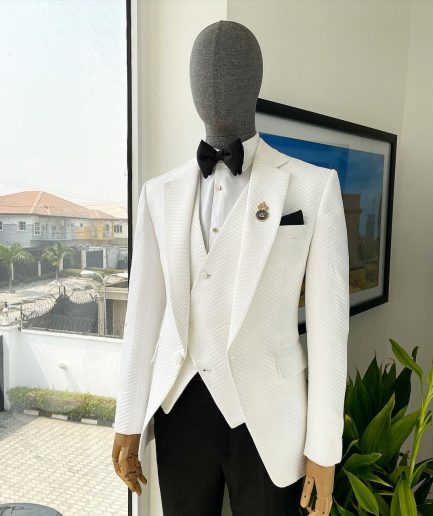 An Ivory white, notch lapel, infinity “maze” line Japanese patterned jacquard suit.