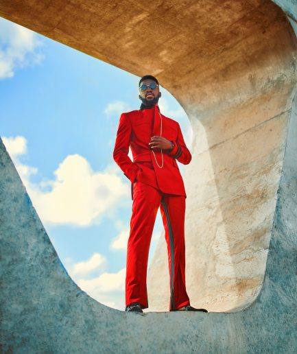 A Crimson red, peak lapel, single button wrap suit