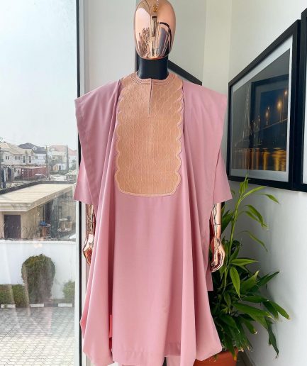 A Flamingo pink, monochrome spiral embroidery detailing Agbada