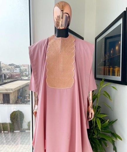 A Flamingo pink, monochrome spiral embroidery detailing Agbada