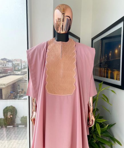 A Flamingo pink, monochrome spiral embroidery detailing Agbada