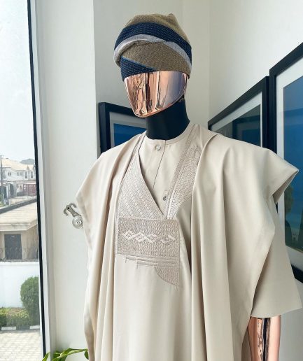 A coconut ivory, jakan design agbada, 3/4 sleeve buba laced with Swarovski stone button details and sokoto