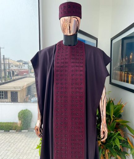 An Umber brown, connected square embroidery design with matching black and brown Swarovski stone details agbada, matching hat, buba & sokoto