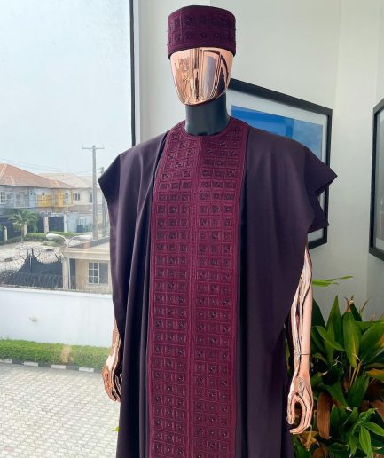 An Umber brown, connected square embroidery design with matching black and brown Swarovski stone details agbada, matching hat, buba & sokoto