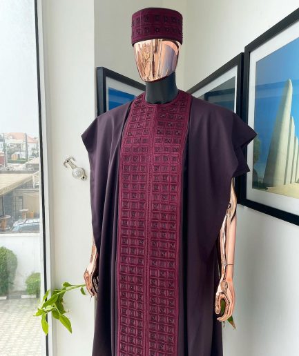 An Umber brown, connected square embroidery design with matching black and brown Swarovski stone details agbada, matching hat, buba & sokoto