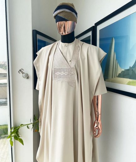 A coconut ivory, jakan design agbada, 3/4 sleeve buba laced with Swarovski stone button details and sokoto