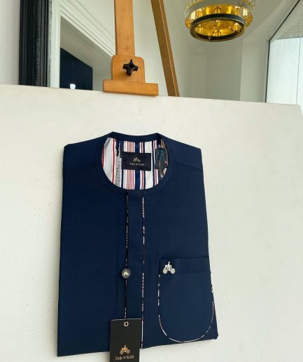 A Navy blue, sport paisley detailing flap and patch pocket and dotted front flap African traditional senator kaftan native.