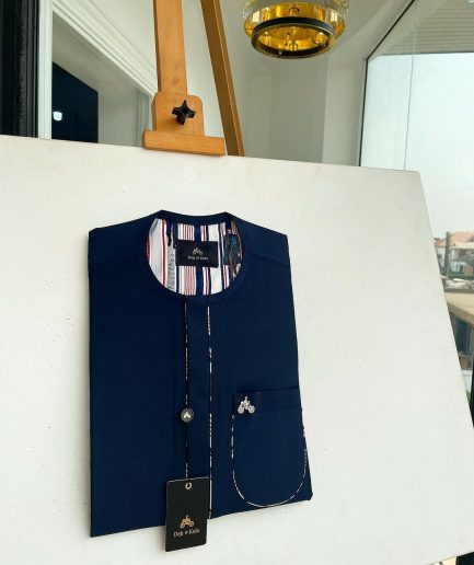 A Navy blue, sport paisley detailing flap and patch pocket and dotted front flap African traditional senator kaftan native.