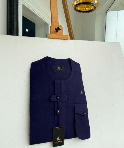 An Eggplant purple, combat front flap and pocket with a black Swarovski button detailing African traditional senator kaftan native.