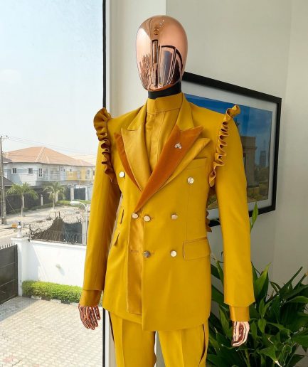 A “Made in Lagos” Wing Flare, Quad peak lapel, triple breasted metallic jacquard blazer suit