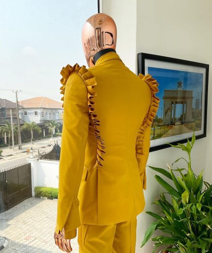 A “Made in Lagos” Wing Flare, Quad peak lapel, triple breasted metallic jacquard blazer suit