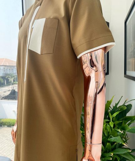 A bishop neck, Peanut and almond cream mix, clear view Swarovski button with layered flap and pocket detailing african traditional senator kaftan native.
