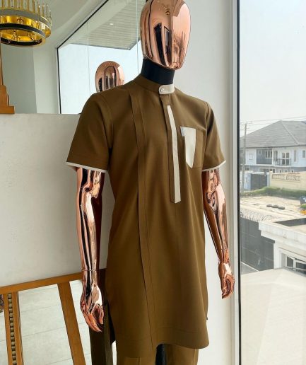 A bishop neck, Peanut and almond cream mix, clear view Swarovski button with layered flap and pocket detailing african traditional senator kaftan native.
