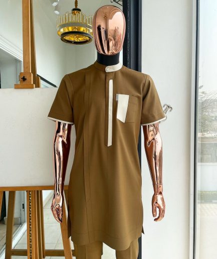 A bishop neck, Peanut and almond cream mix, clear view Swarovski button with layered flap and pocket detailing african traditional senator kaftan native.