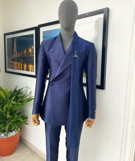 A Mikado Silk “rumble in jungle”, wrap Notch lapel, slant sache blazer suit.