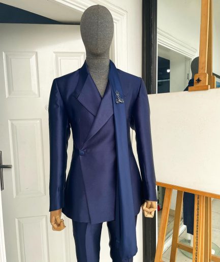 A Mikado Silk “rumble in jungle”, wrap Notch lapel, slant sache blazer suit.