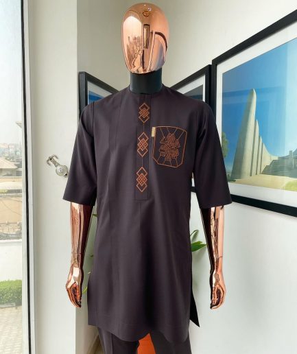 An umber brown, 3D precision anchor embroidery flap and pocket detailing African traditional senator Kaftan native