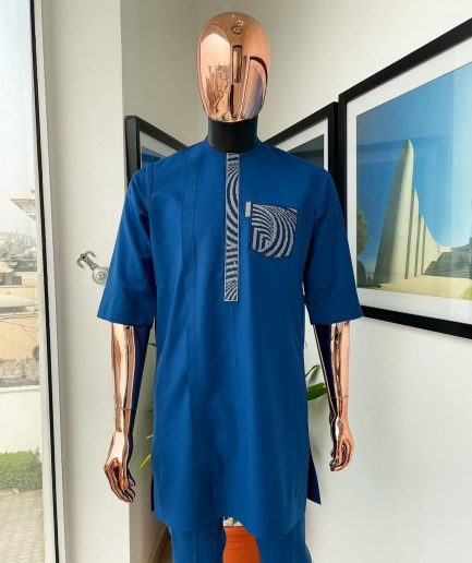 An azure blue, curly 3D embroidery flap and pocket detailing African traditional senator kaftan native