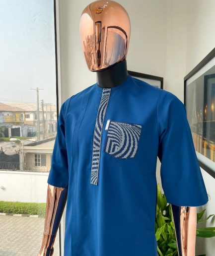 An azure blue, curly 3D embroidery flap and pocket detailing African traditional senator kaftan native