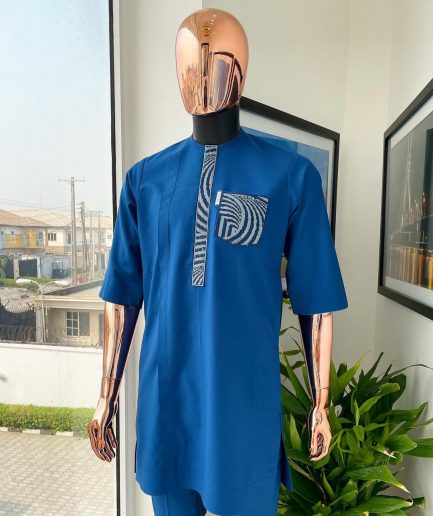 An azure blue, curly 3D embroidery flap and pocket detailing African traditional senator kaftan native
