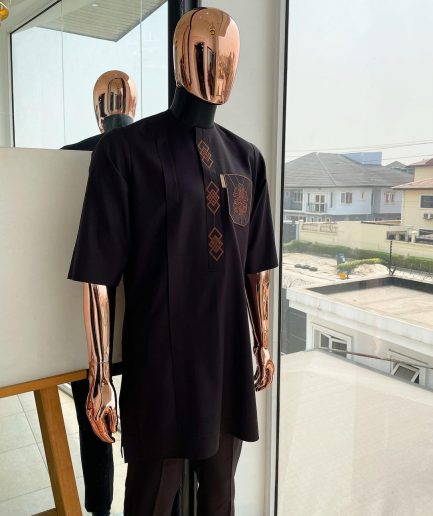 An umber brown, 3D precision anchor embroidery flap and pocket detailing African traditional senator Kaftan native