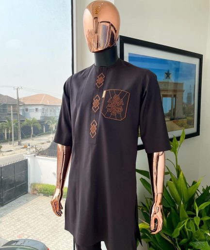 An umber brown, 3D precision anchor embroidery flap and pocket detailing African traditional senator Kaftan native