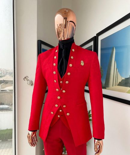 An “empire” candy red, floral patterned metallic jacquard suit