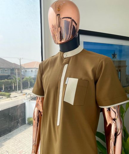 A bishop neck, Peanut and almond cream mix, clear view Swarovski button with layered flap and pocket detailing african traditional senator kaftan native.