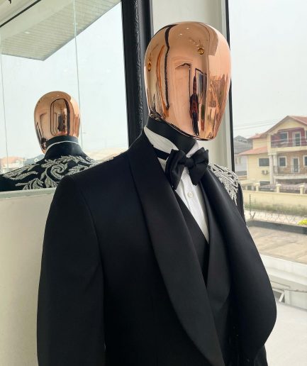 The “Trailblazers” charcoal black, shawl lapel tuxedo suit with metallic silver adornments