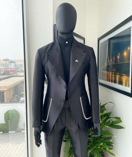 The Monochrome “okorodudu” mikado satin, charcoal black, big-notch lapel suit.