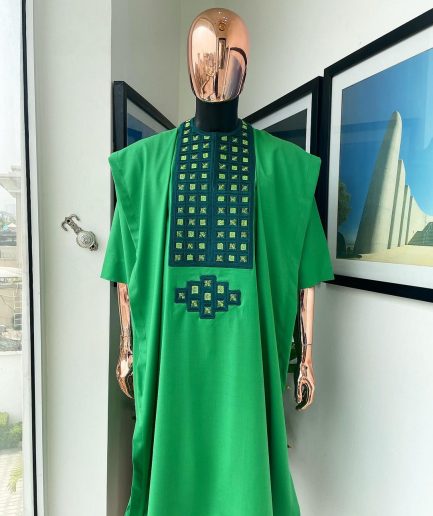 A Shamrock green, connected square embroidery design with matching silver and parakeet green Swarovski stone details agbada