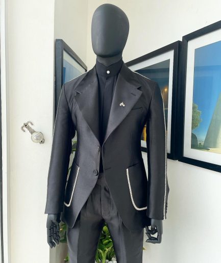 The Monochrome “okorodudu” mikado satin, charcoal black, big-notch lapel suit.